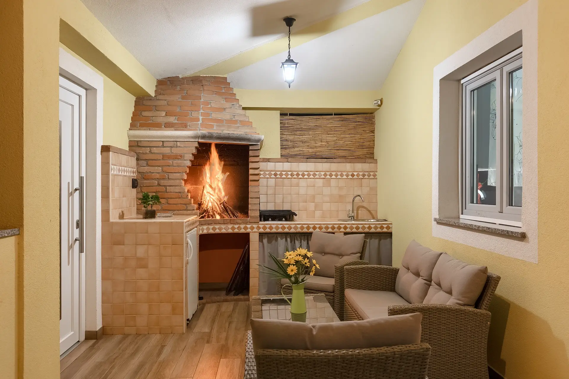 Traditional brick fireplace and lounge seating.